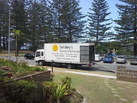 Removalist professionally packing furniture